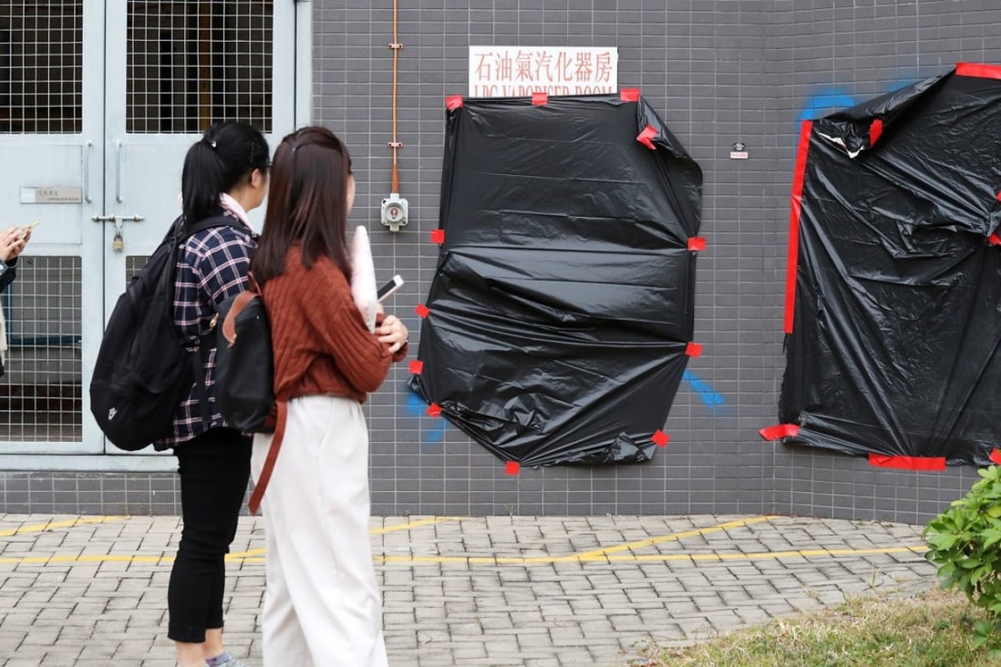 Graffiti on a building on the Baptist University campus is covered up. Young people and students have a right to express their opinions, and to speak out when they think something is wrong. But they need to do it within particular boundaries, with basic manners. Photo: K. Y. Cheng