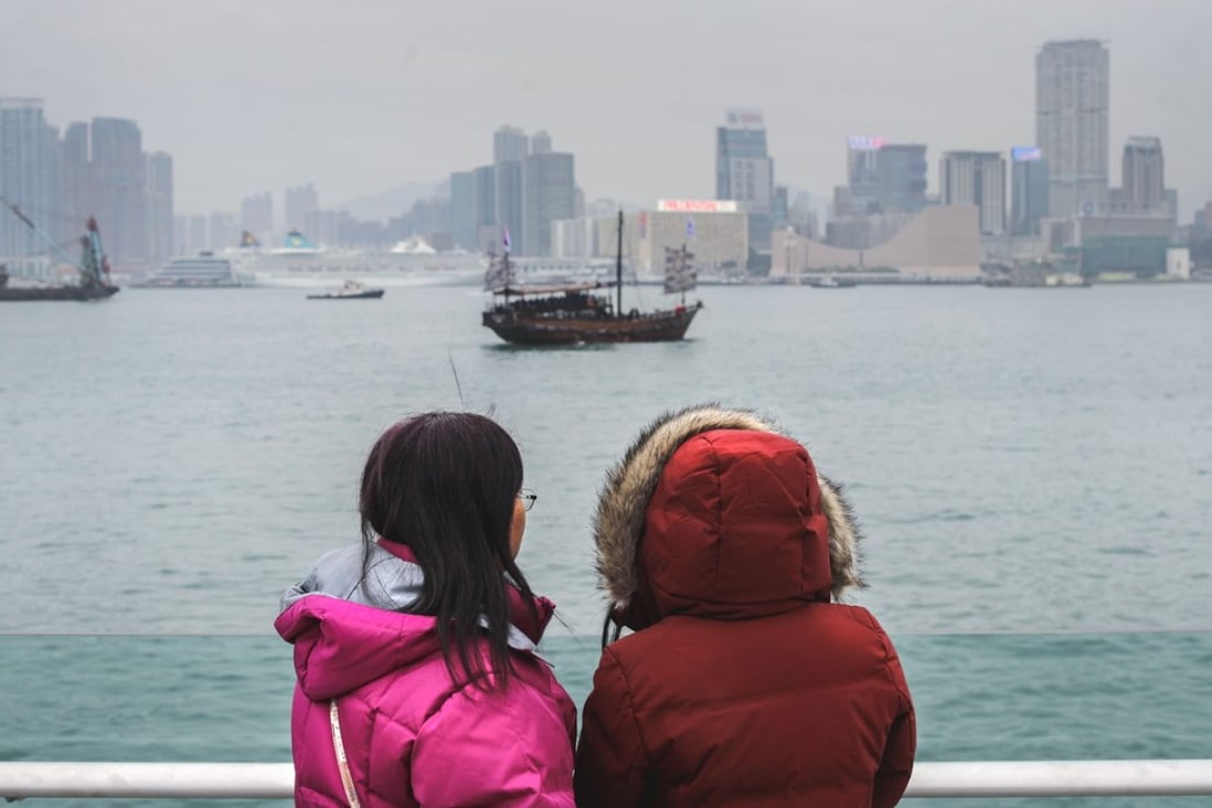 Sightseers taking in the view on a cold day in Admiralty. Photo: Winson Wong