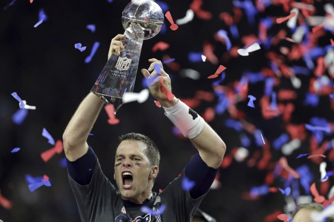 New England Patriots quarterback Tom Brady raises the Vince Lombardi Trophy after defeating the Atlanta Falcons in overtime at Super Bowl 51 in Houston, Texas. Photo: AP