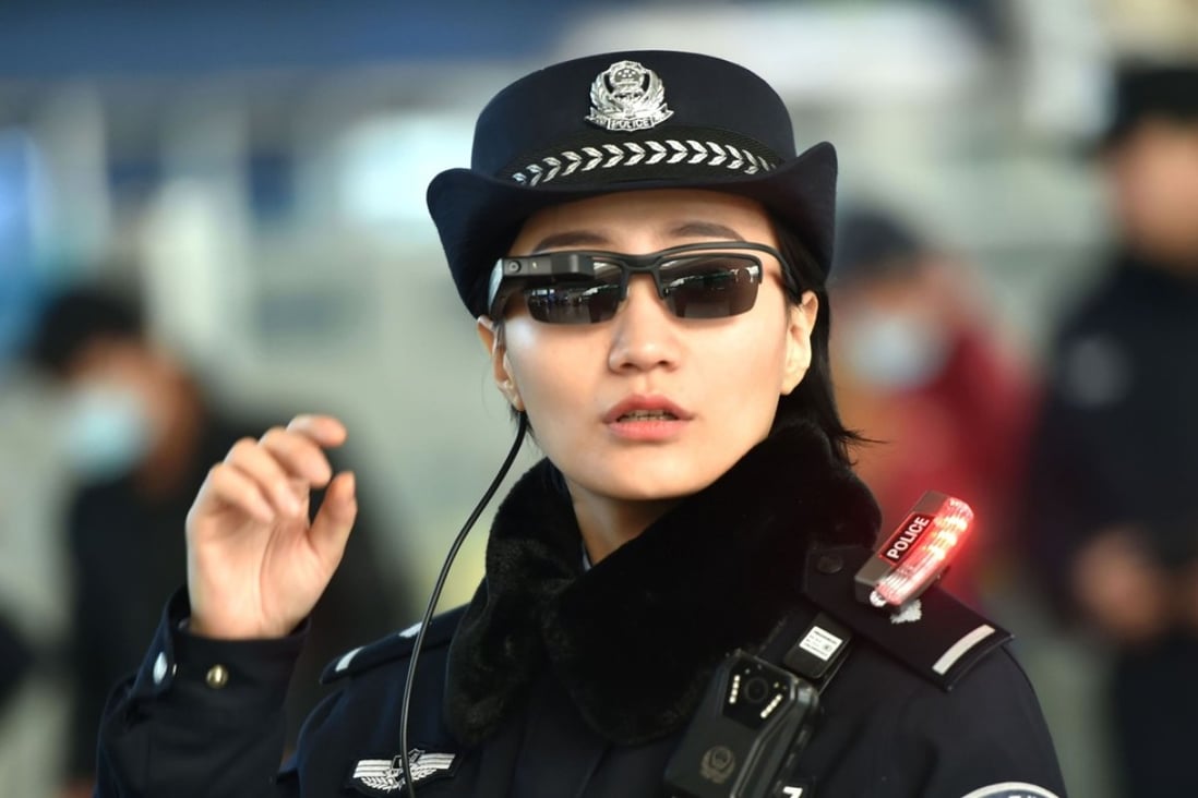 A police officer using the facial recognition glasses. Photo: AFP