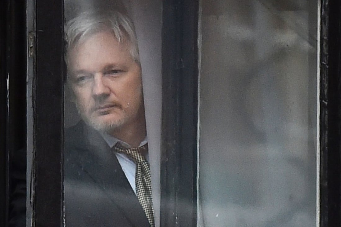 WikiLeaks founder Juilan Assange (seen coming out onto the balcony of the Ecuadorean embassy on Monday) has lost a bid to have his UK arrest warrant thrown out, leaving him stranded in the embassy – where he has already lived for five years – for the foreseeable future. Photo: AFP