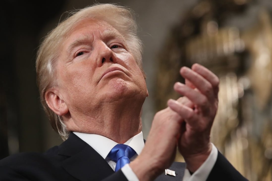 US President Donald Trump claps after finishing his first State of the Union address on January 30. Since delivering his unifying message, Trump’s decision to release a memo accusing the FBI and the Department of Justice of misconduct has widened the divide between the Republicans and the Democrats. Photo: EPA-EFE