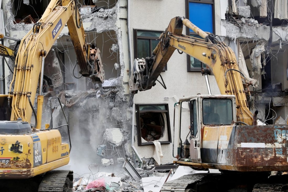 Excavators demolish the collapsed Marshal hotel after tremors hit Hualien in Taiwan. Photo: Reuters