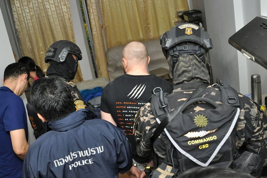 Russian Sergey Medvedev being arrested by Thai police in Bangkok. Photo: AFP