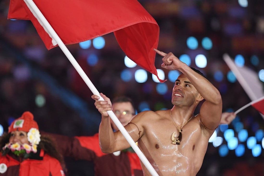 Team Tonga with flag bearer Pita Taufatofua arrive at the opening ceremony of the Pyeongchang Winter Olympics. Photo: EPA