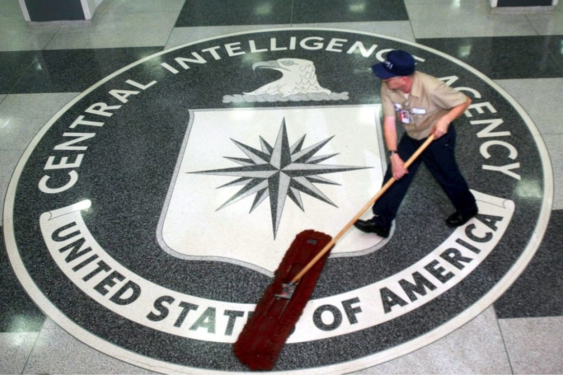 A cleaner sweeping the reception area at CIA Headquarters, Langley, Virginia. Photo: EPA
