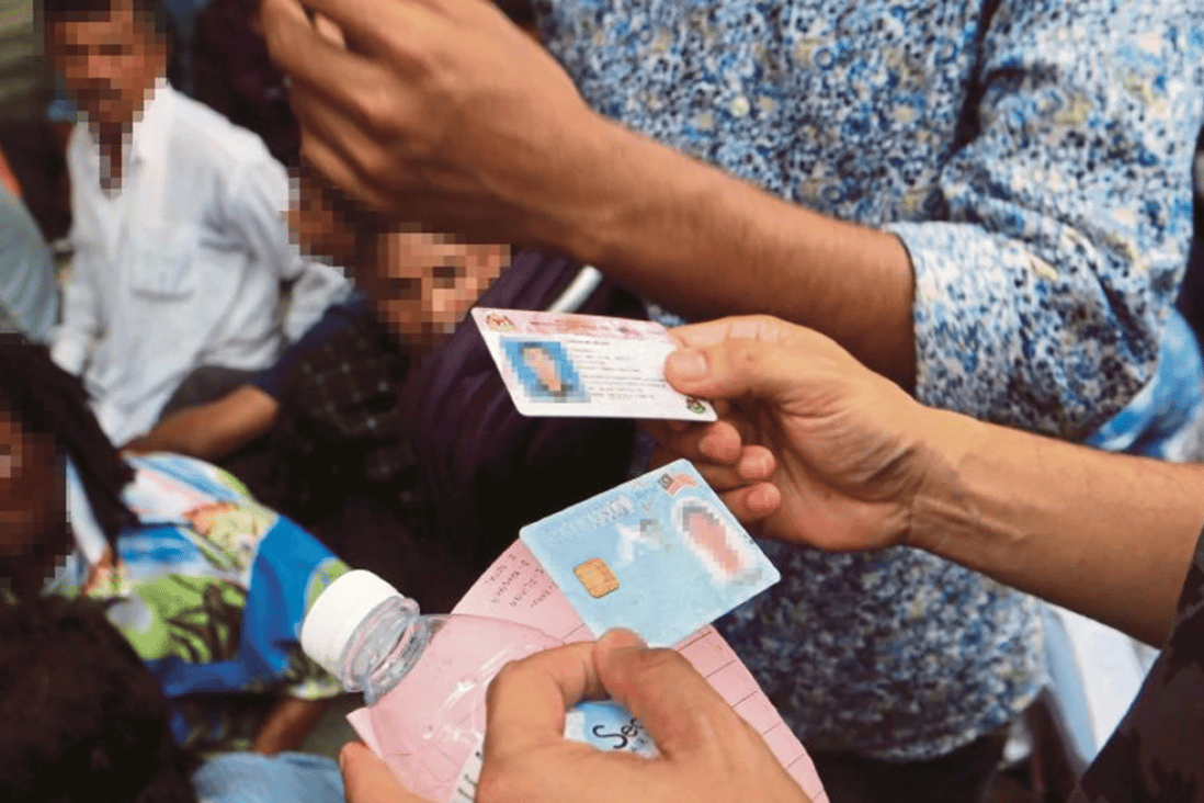 Foreigners with fake Malaysian identification documents pose a serious threat to national security. Photo: Eizairi Shamsudin/New Straits Times