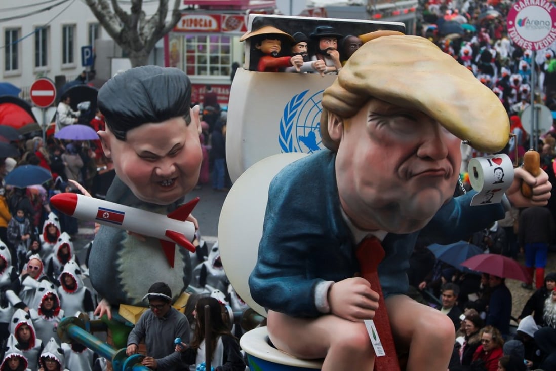 A carnival chariot is seen with figures of US President Donald Trump and North Korean leader Kim Jong-un holding a rocket during a parade in Torres Vedras, Portugal, on February 11, 2018. Photo: Reuters