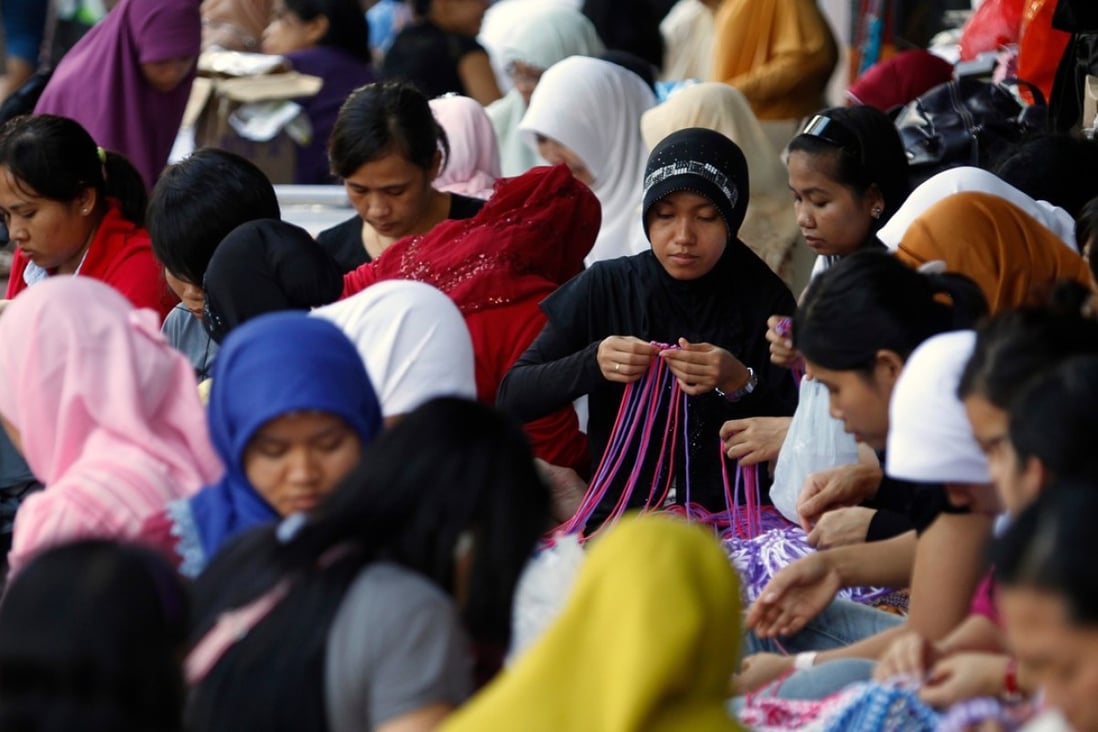 Domestic helpers gather in Hong Kong. Photo: Agence France-Presse