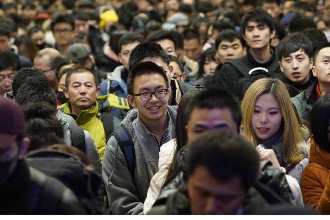 Days before the eve of Lunar New Year, Beijing was moving into holiday mode. Pictured: travellers at Beijing Railway Station. Photo: Xinhua