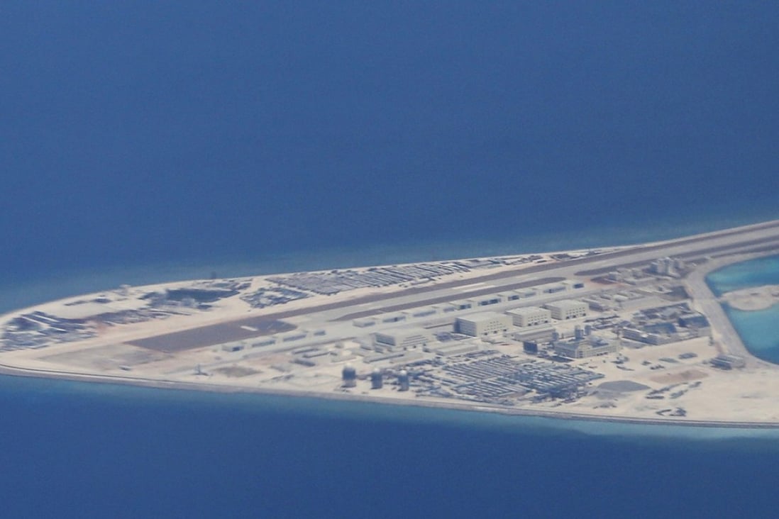 A file picture taken in May last year of Chinese building work, including an airstrip, on Subi Reef in the disputed Spratly chain of islands in the South China Sea. Photo: Associated Press