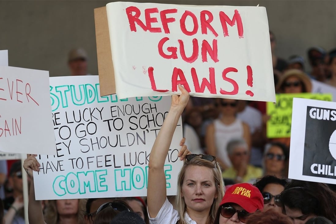 Thousands of people join together after a school shooting that killed 17 to pleading with lawmakers to change the nation’s gun laws. Photo: Getty Images/AFP