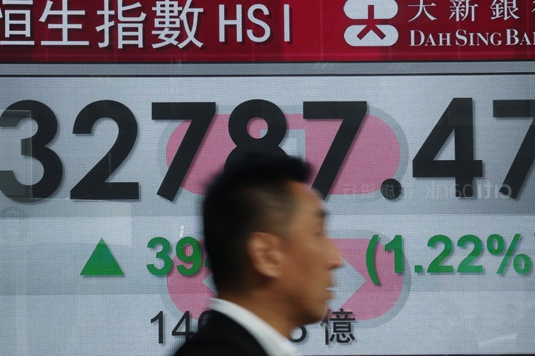 It’s January 23, 2018, and an electronic stock board shows the Hang Seng Index rising briskly. It rose a ridiculous 9 per cent rise in January. Photo: Edward Wong