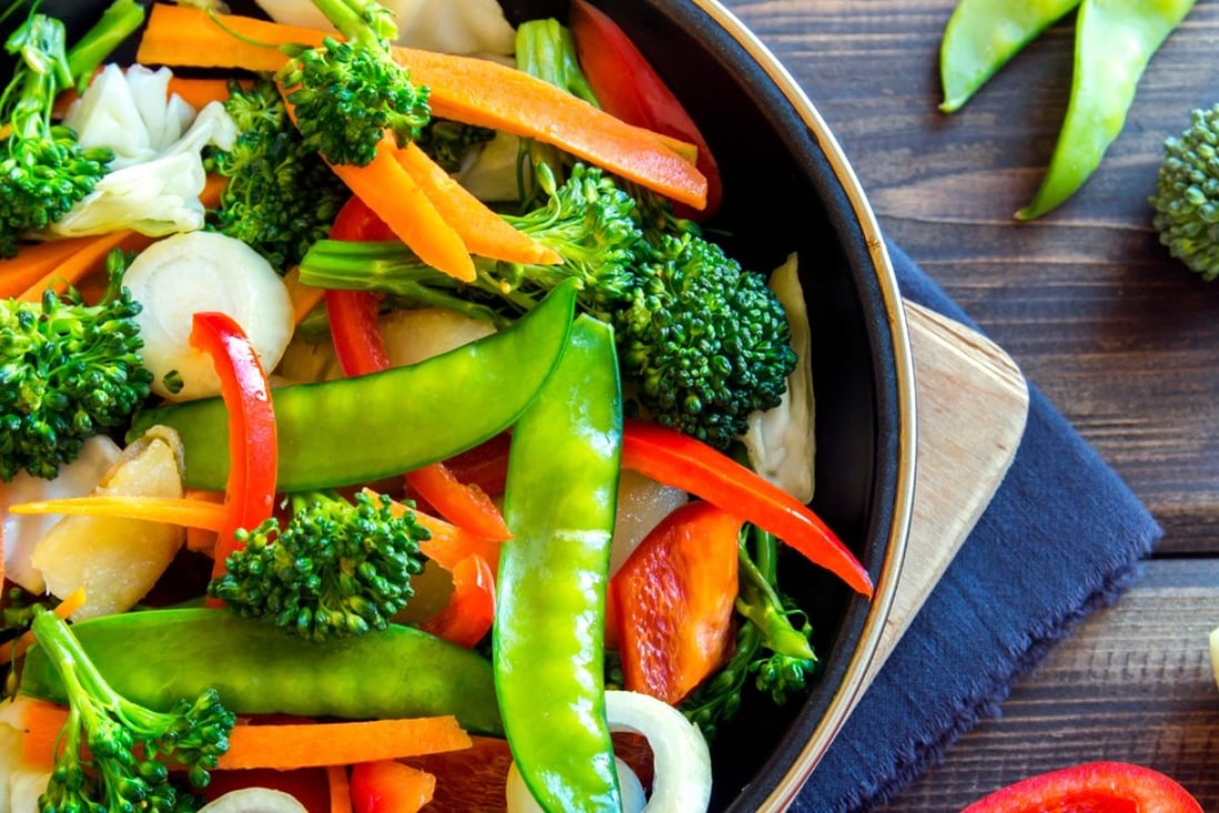 A pan full of healthy stir-fried vegetables. According to a recent Stanford University study, what seemed to help people lose weight was following a single strategy: eat less sugar, less refined flour, and as many vegetables and whole foods as possible. Photo: Alamy