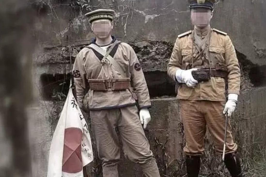 Two men posed in imperial Japanese soldier uniforms at a memorial site in Nanjing. Photo: huanqiu.com