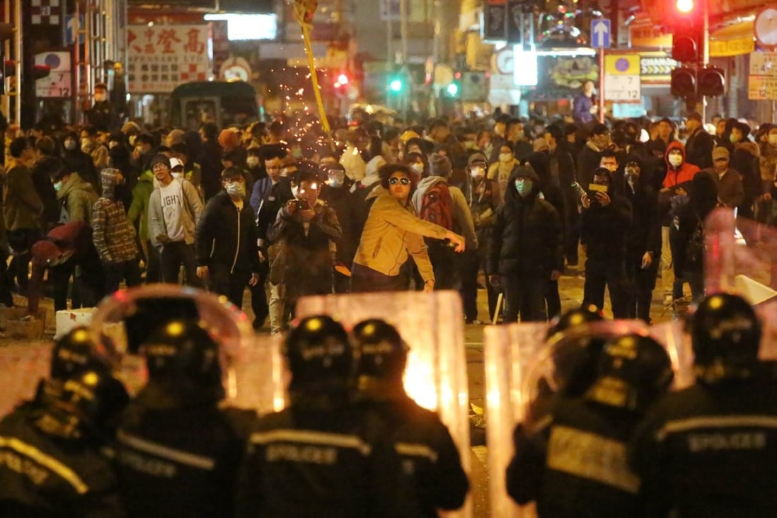 Police confront protesters in Mong Kok during clashes over the Lunar New Year holiday in 2016. Photo: Edward Wong