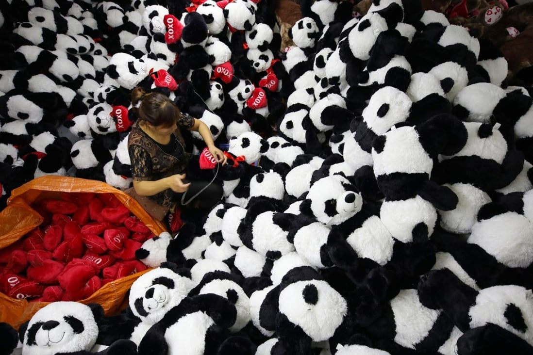 A worker makes toys at a factory in Lianyungang in Jiangsu province. While China’s economy grew at 6.9 per cent in 2017, an IMF report has raised concern about the stability of the country’s financial system. Photo: Xinhua