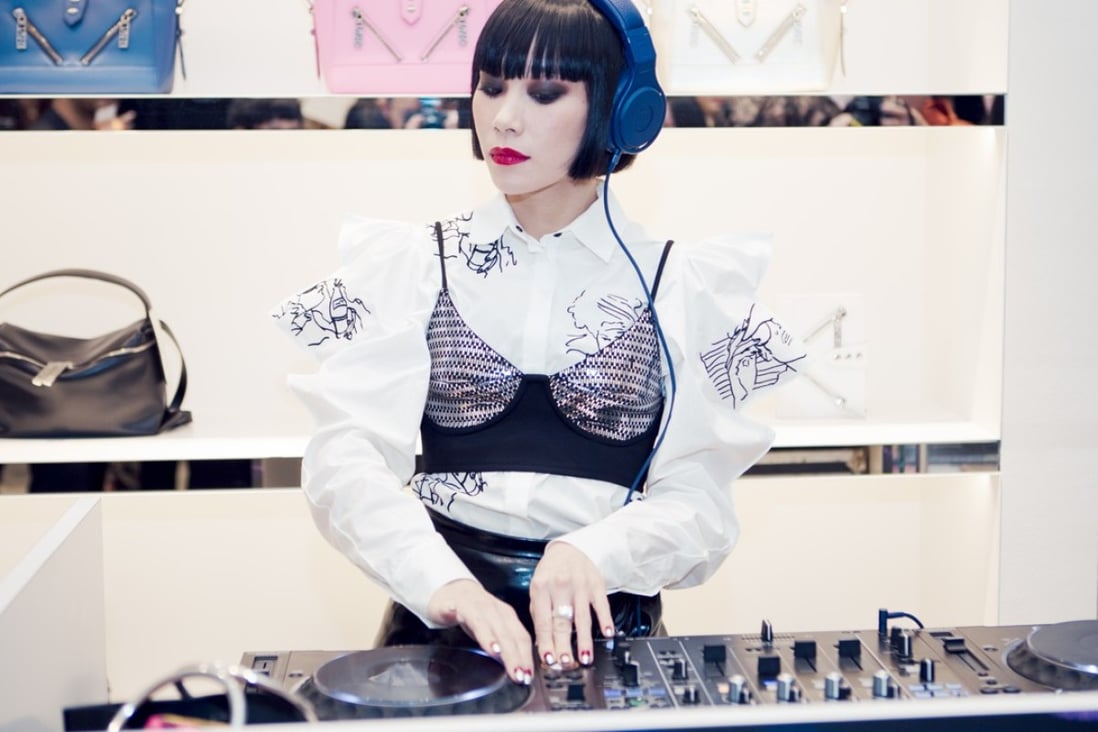 Mademoiselle Yulia DJs at a Kenzo event.