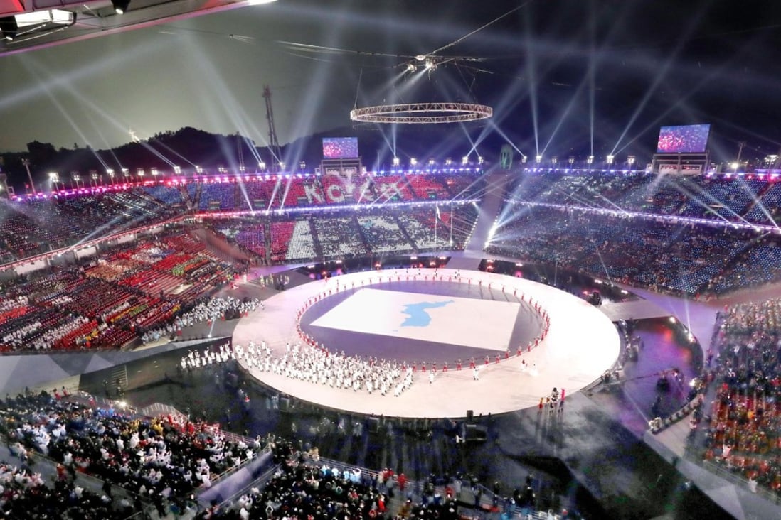 Athletes of North and South Korea enter the stadium with Korean unification flags during the opening ceremony of the Pyeongchang Winter Olympics. Photo: Kyodo