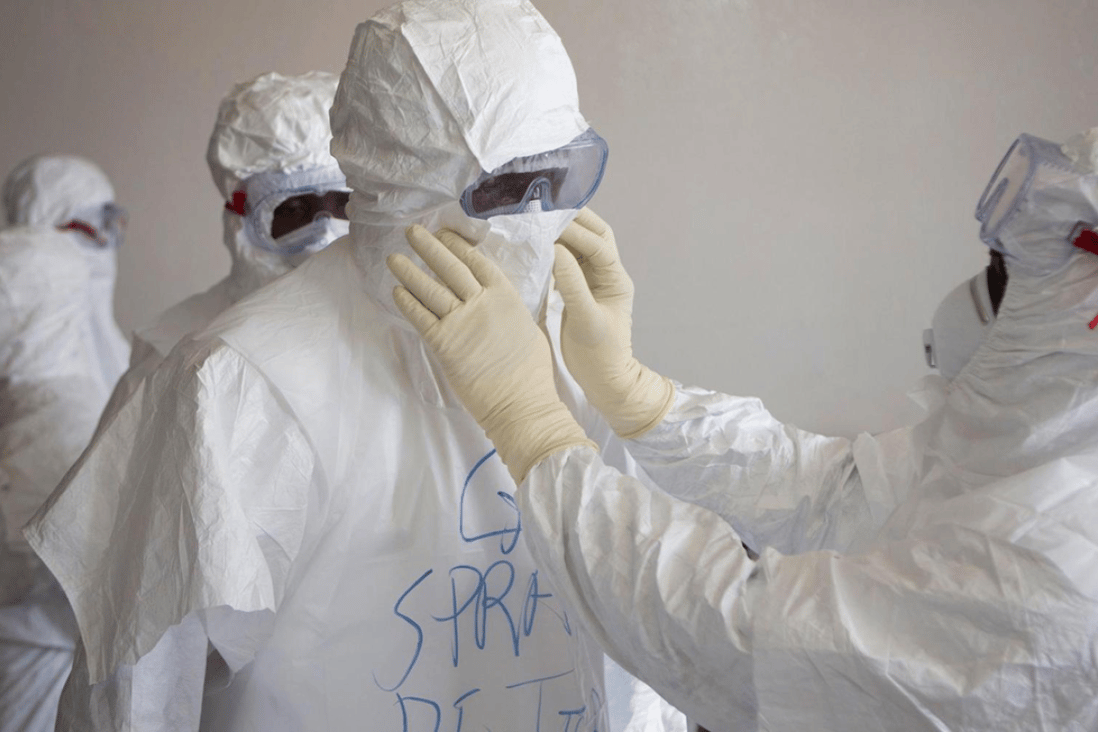 Health workers don protective equipment at the Island Clinic in Monrovia, Liberia. Photo: Christopher Black/WHO/Reuters