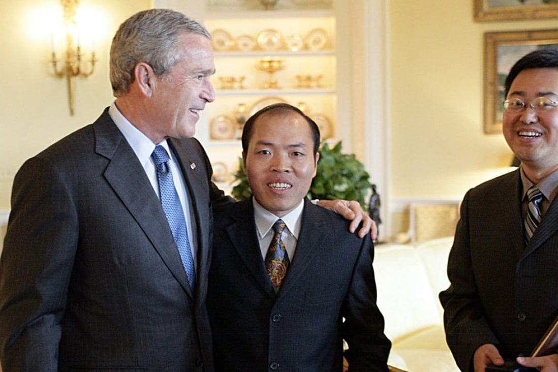Lawyer Li Baiguang (centre) was recognised for his long-term efforts to defend the rights of farmers and Christian pastors in China. In this file photograph from 2006 he is seen meeting then US President George W Bush, who promised the activist he would raise the issue of religious freedom with China's leaders. Photo: AFP