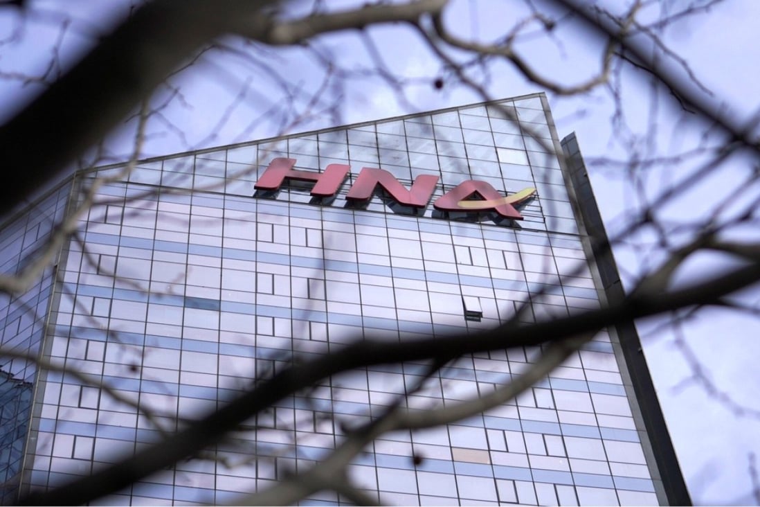 The HNA Group logo on its HNA Plaza in Beijing. Reports suggest it could be cutting a quarter of its workforce. Photo: Reuters