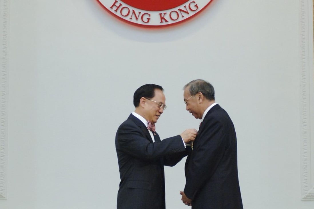 Former chief executive Donald Tsang (left) presented former chief secretary Rafael Hui with the Grand Bauhinia Medal in 2007. Photo: ISD