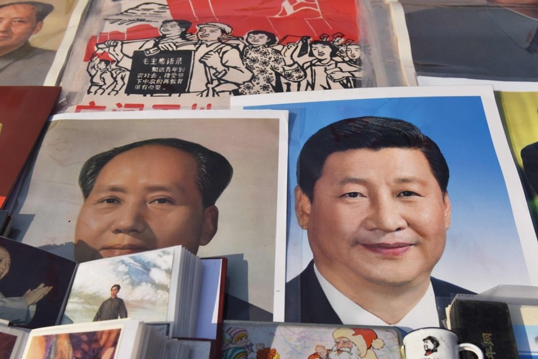 Posters of Mao and Xi Jinping at a market in Beijing. Photo: AFP