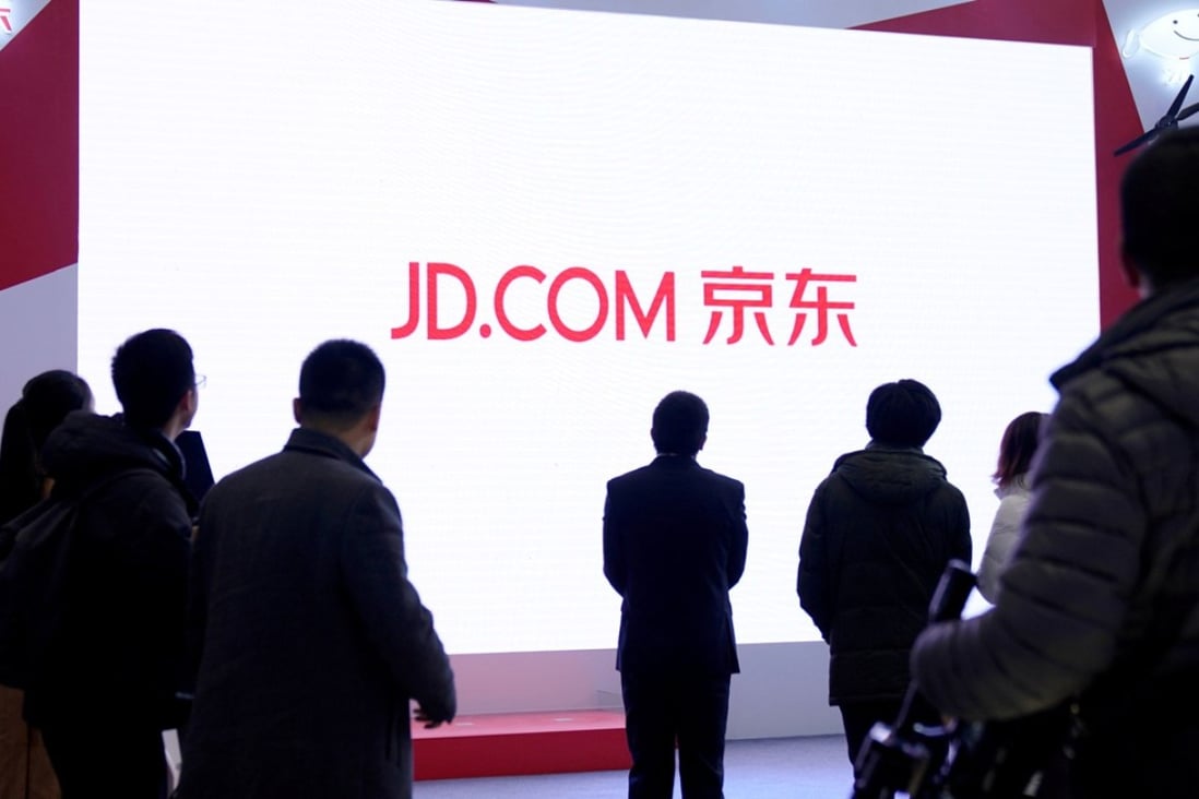 A JD.com sign is seen during the fourth World Internet Conference in Wuzhen, Zhejiang province, in December last year. China’s second largest e-commerce company saw its US-listed shares drop after reporting lower-than-expected quarterly profit on Friday. Photo: Reuters