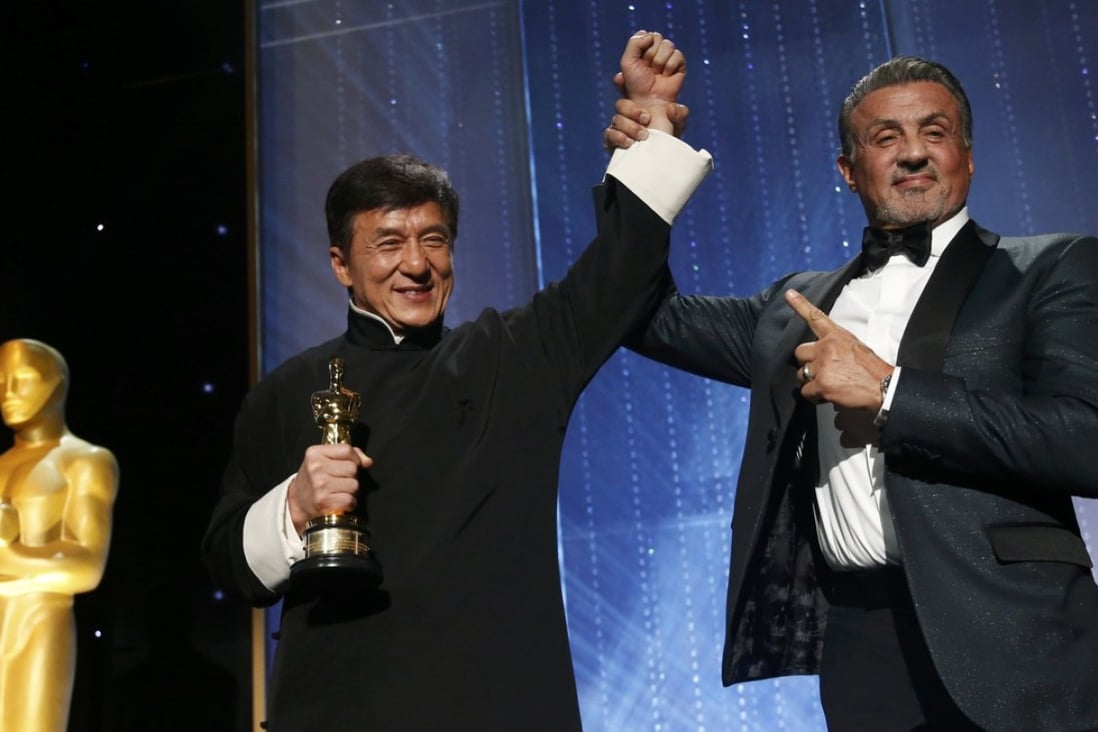 Jackie Chan (left) being congratulated by Sylvester Stallone after accepting his Honorary Award at the 8th Annual Governors Awards in Los Angeles in 2016. Photo: Reuters