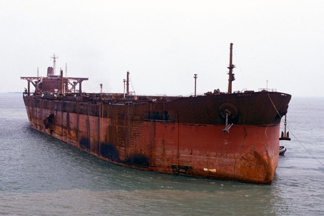 Seawise Giant, having been renamed Happy Giant, being towed into Singapore for repairs after her sinking.