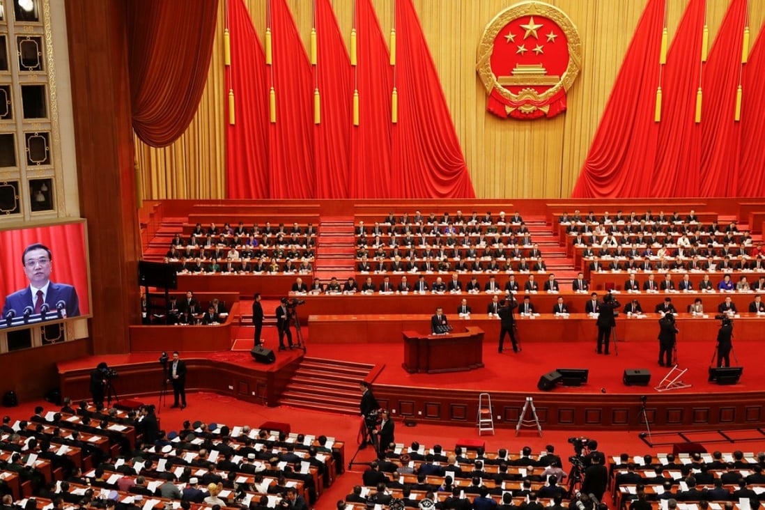 Chinese Premier Li Keqiang delivers his annual government work report at the opening meeting of the first session of the 13th National People's Congress at the Great Hall of the People in Beijing on Monday. Photo: Reuters