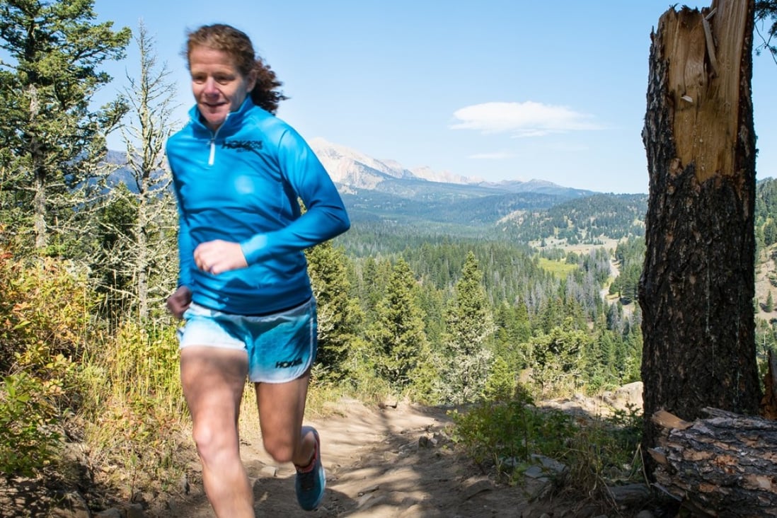 Ultra runner and depression sufferer Nikki Kimball running in the Montana hills where she lives.