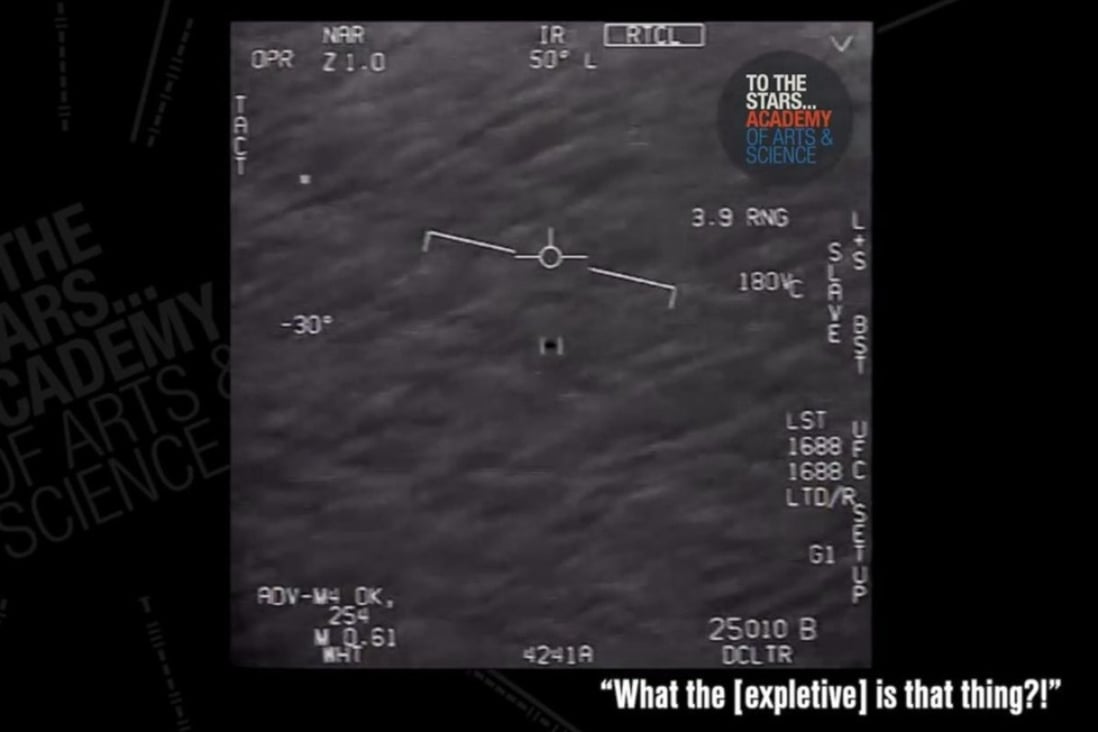 A still image taken from a US Navy video released on Monday appears to show a UFO skimming low over the ocean. The video was said to have been shot off the US East Coast in 2015. Photo: TTSA / US Navy