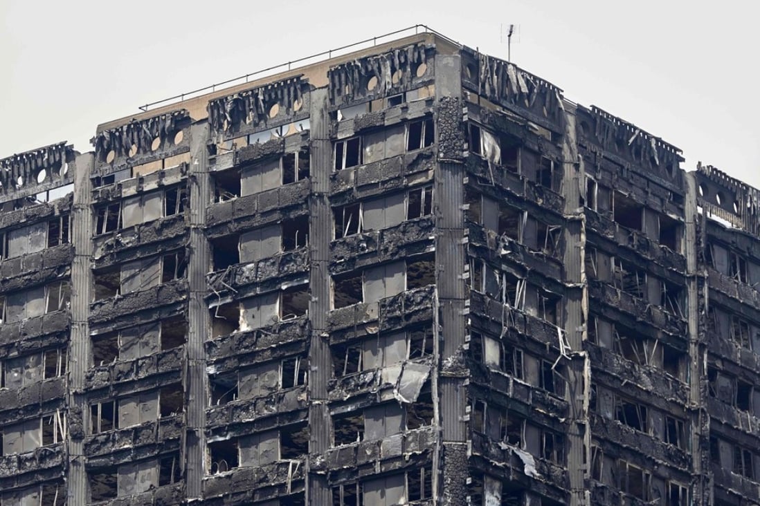 The charred remains of cladding are pictured on the outer walls of the burnt out shell of the Grenfell Tower block in north Kensington, west London on June 22, 2017. Photo: AFP