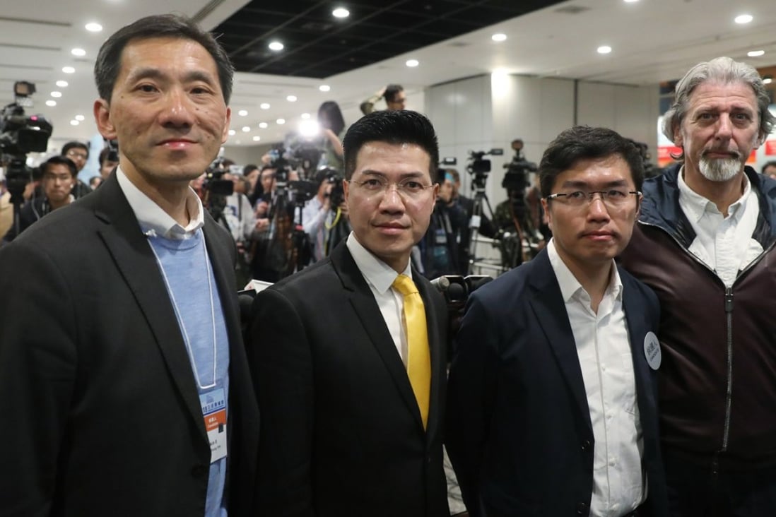 Pan-democrat candidates (left to right) Edward Yiu, Gary Fan, Au Nok-hin and Paul Zimmerman wait for the results of the Legislative Council by-election at the Hong Kong Convention and Exhibition Centre in Wan Chai on March 12. Photo: Sam Tsang