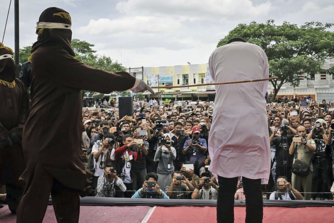 The conservative Indonesian province of Aceh is known for publicly caning or whipping gay people, adulterers and gamblers. Officials are now considering introducing beheading as a punishment for murder. Photo: AP