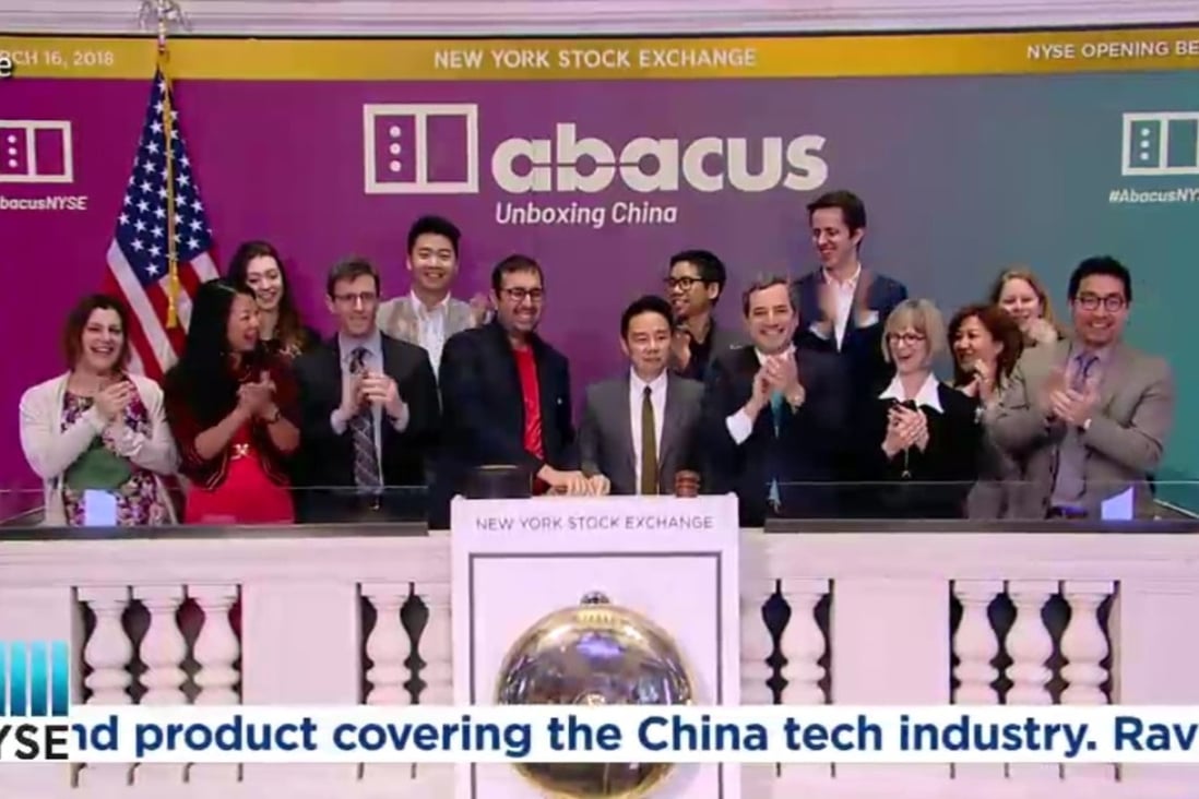 Abacus executive producer Ravi Hiranand (sixth from left) and Malcolm Ong, group director for product at SCMP Publishers (seventh from left), ring Friday’s opening bell at the New York Stock Exchange, marking the launch of Abacus – a news site focused on China’s technology industry. Photo: Abacus