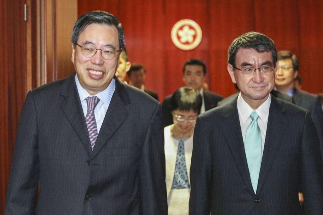 Legislative Council President Andrew Leung Kwan-yuen (left) with Japanese foreign minister Taro Kono (right) at Tamar. Photo: Felix Wong