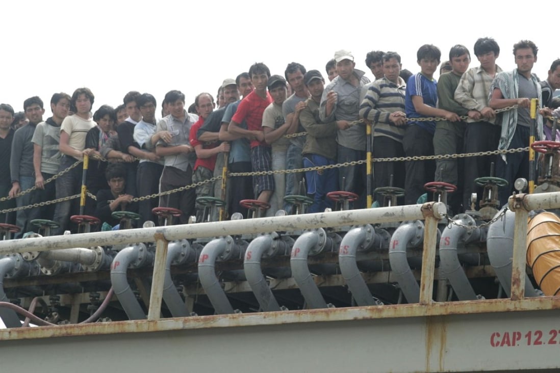 Asylum seekers are evacuated by Indonesian authorities from a tanker in Merak in Indonesia. Photo: AFP