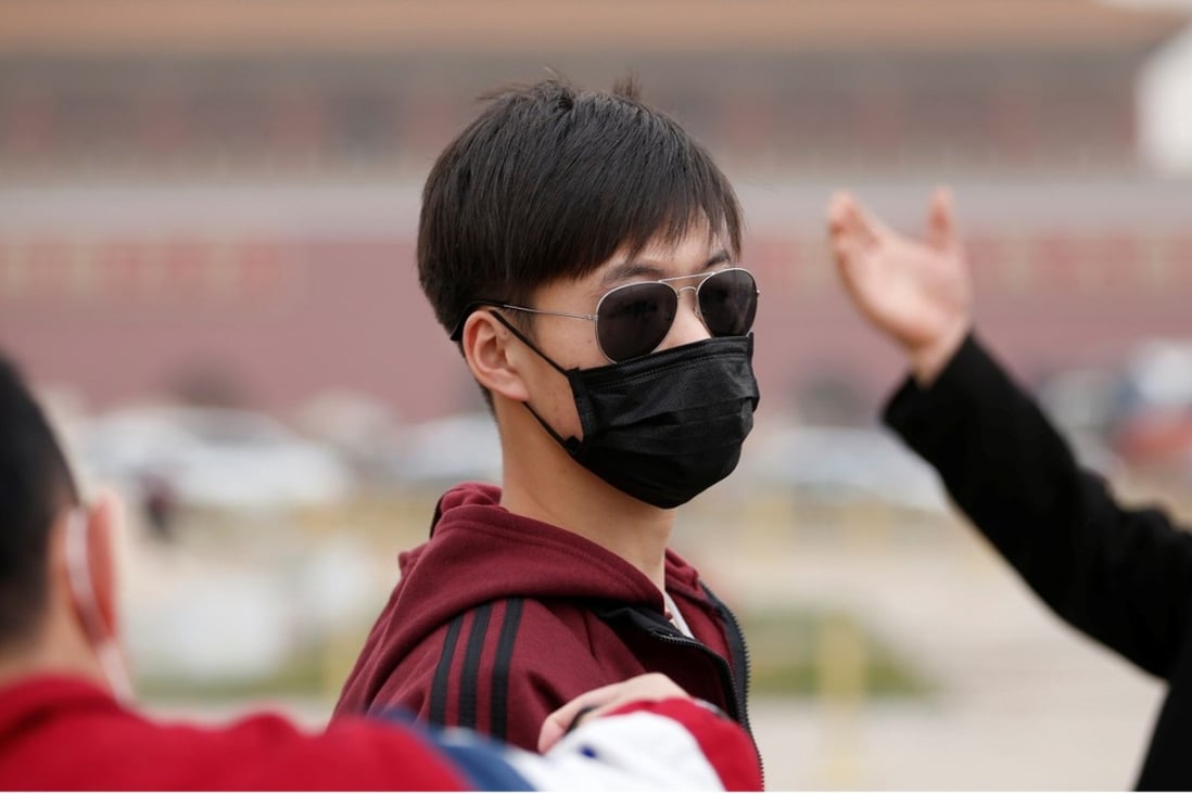Residents and visitors to Beijing wore face masks on Wednesday to protect against the air pollution. Photo: Reuters