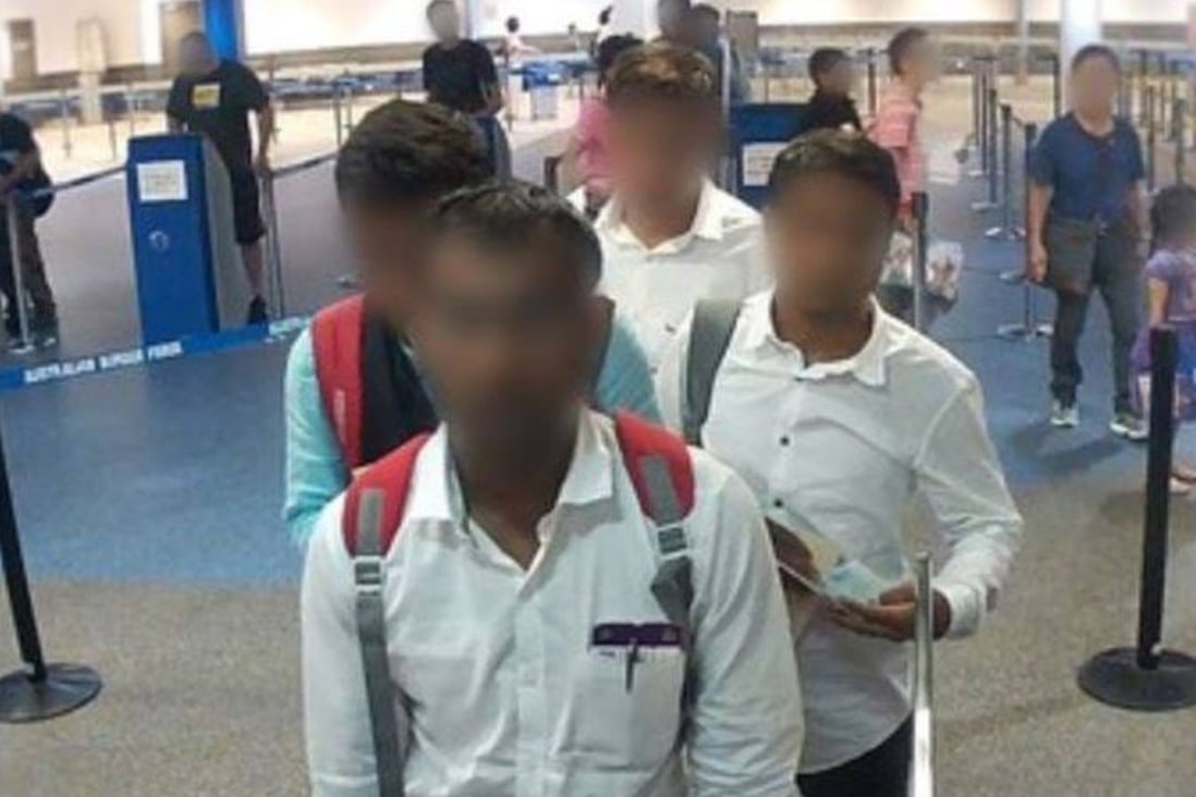 The group of fake reporters arrive at Brisbane Airport on Wednesday holding Temporary Activity Visas, claiming to be accredited media representatives, in this photo provided by the Australian Border Force. Photo: ABF