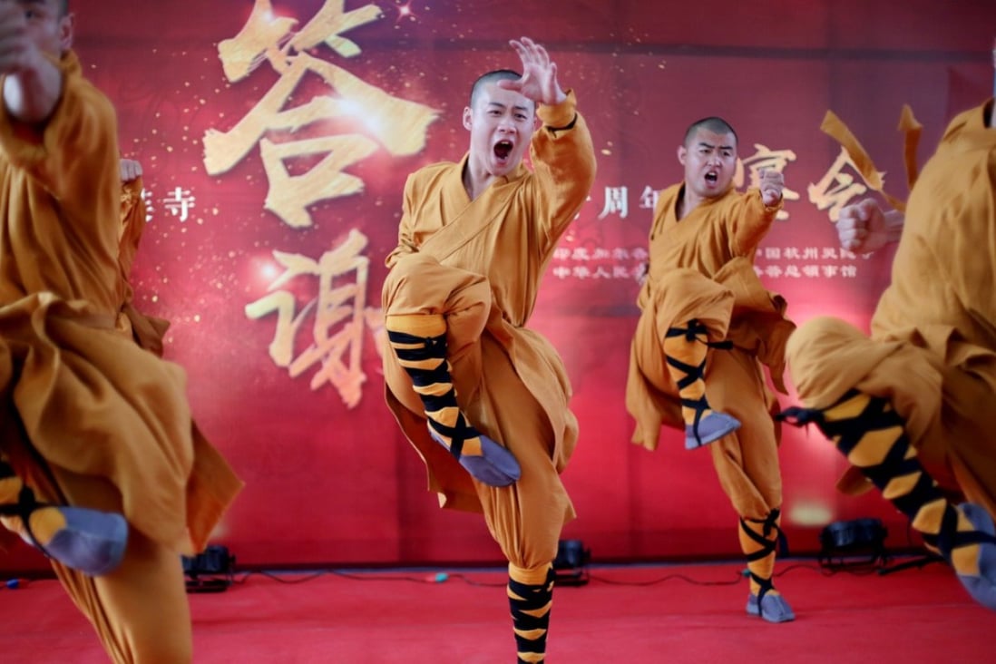 Chinese monks perform martial arts during a Chinese festival at Hsuan Tsang Monastery in Kolkata, India, on March 14. The two-day festival was organised by the Chinese consulate to mark the 50th anniversary of the monastery. Photo: EPA-EFE 