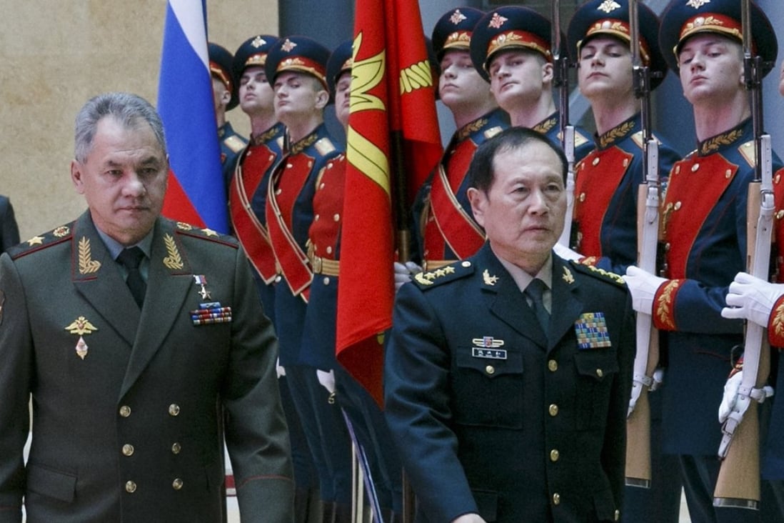 Russian Defence Minister Sergei Shoigu (left) and Chinese Defence Minister Wei Fenghe are seen in front of a row of guards before their talks in Moscow on Wednesday. Photo: Russian Defence Ministry Press Service via EPA/EFE