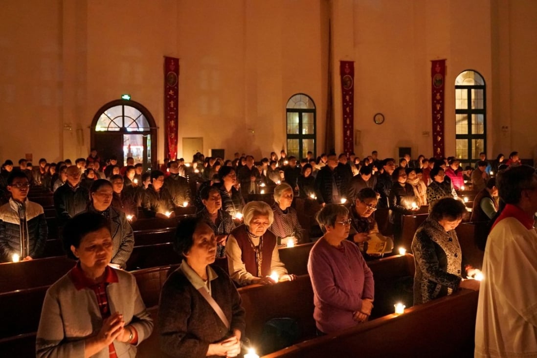 The faithful attend the Easter Vigil at a Catholic church in Shanghai, on March 31. Photo: Reuters