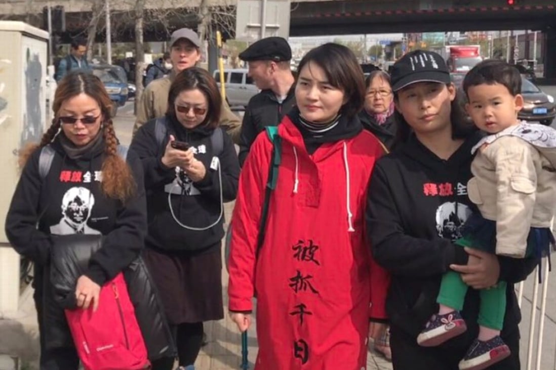 Li Wenzu (in red coat) begins her march from Beijing to Tianjian to find out what happened to her husband, Wang Quanzhang, a human rights lawyer who has been missing since August 2015. Photo: Twitter
