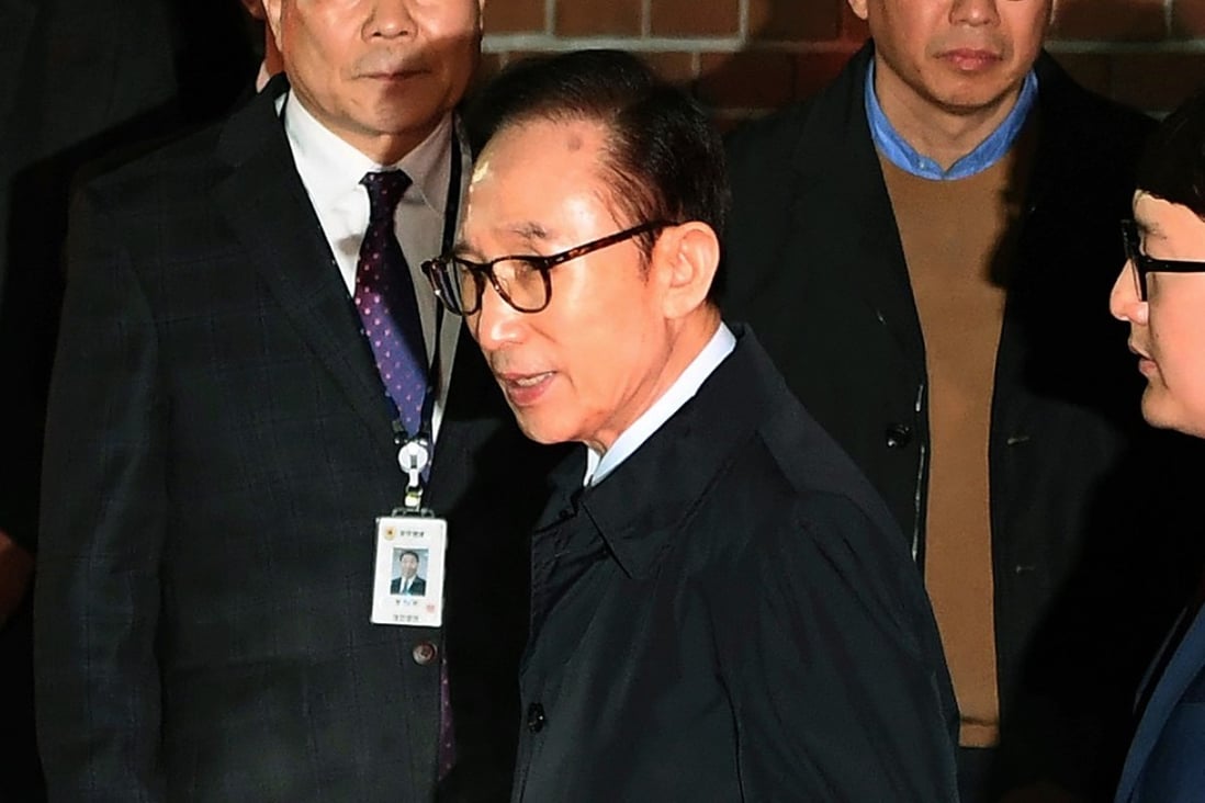 Former South Korean President Lee Myung-bak on his way to a detention centre. Photo: AP