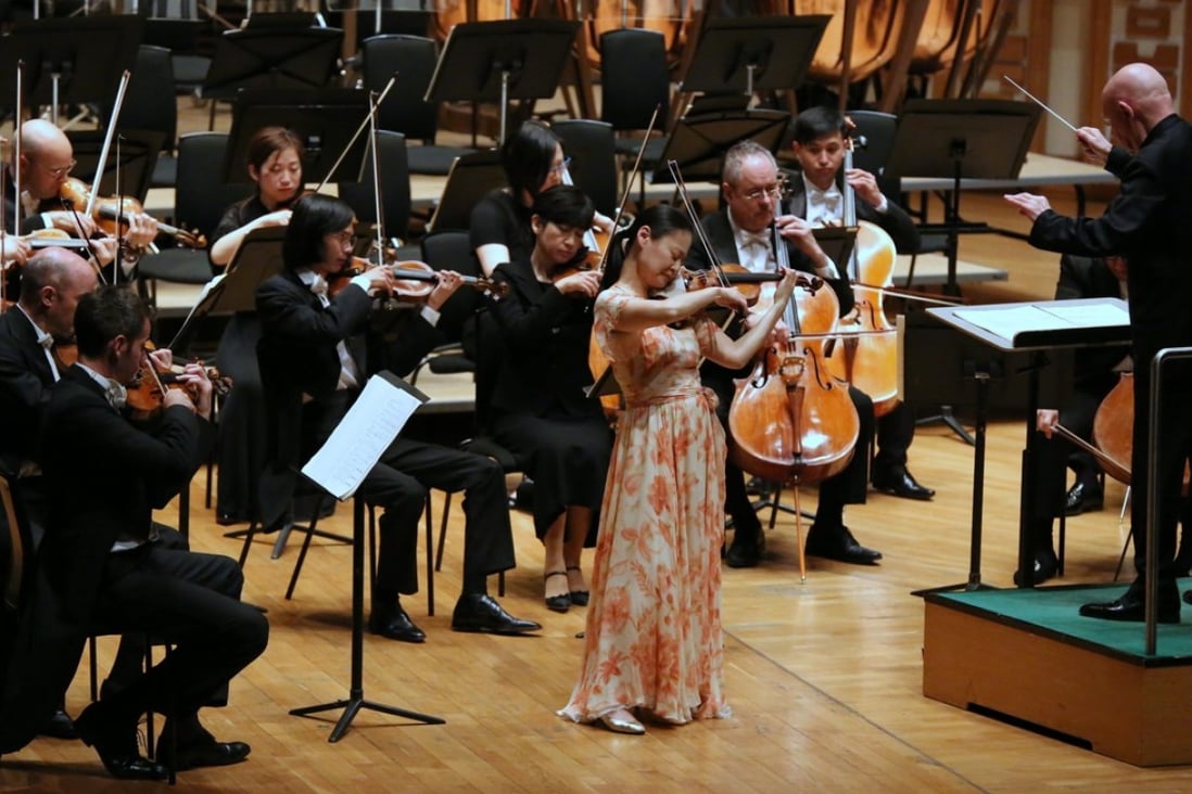 Violinist Midori performing with the Tongyeong Festival Orchestra under the baton of German conductor Christoph Eschenbach at the Hong Kong Cultural Centre Concert Hall.