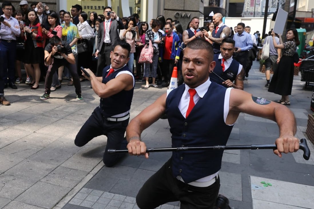 Members of “Badboys Australia” perform in Central to promote “18+ Central”, billed as the first adult-themed carnival in Hong Kong, on March 28. Photo: Sam Tsang