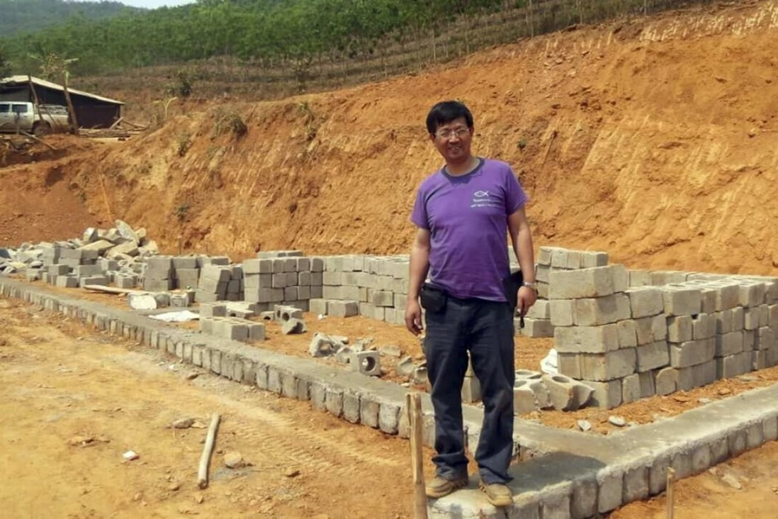 Reverend John Sanqiang Cao breaks ground on a school in Wa State, Myanmar. Photo: AP